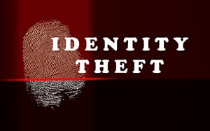 Identity theft concept with thumb print and red scanner lights